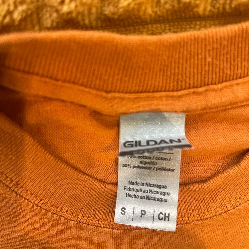 Size small short sleeve t-shirt. Bought at boutique.